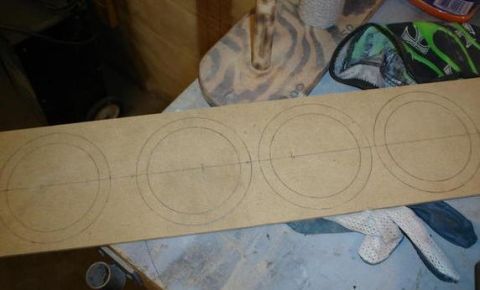 1984 Ford Bronco - MDF board marked with circles for speaker installation.