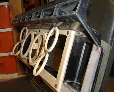 1984 Ford Bronco - A custom dashboard modification features wooden rings and a SuperMotors logo visible on the lower right.