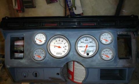 1984 Ford Bronco - Custom dashboard assembly multiple gauges, including fuel, volts, RPM, MPH, and water temperature.
