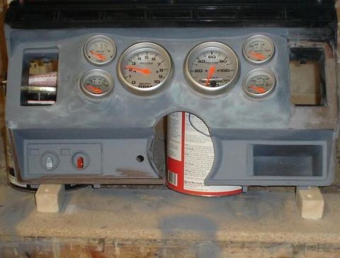 1984 Ford Bronco - A custom dashboard panel is shown with various gauges and switches, ready for installation.