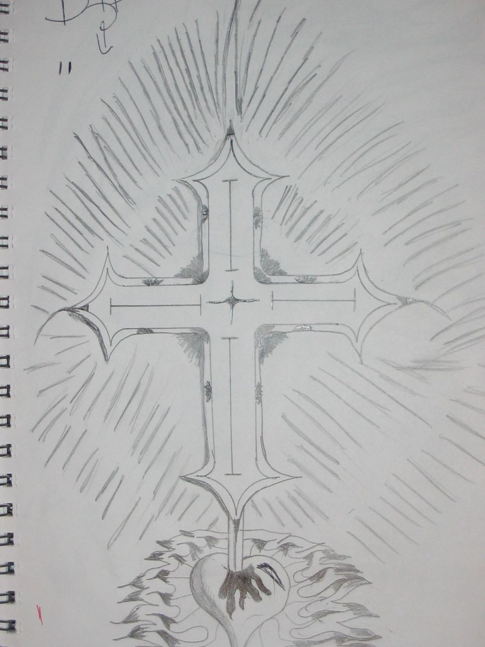Pencil drawing of a cross with radiating lines and a heart at its base, on a spiral-bound notebook page