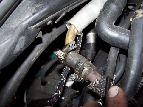 2000 Ford Crown Victoria - FUBAR setup left hidden by heat wrap. The section that covered the exposed area has been cut away. Yes, that is actually heater hose. It he…