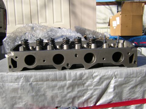 1979 Ford Bronco - A single engine cylinder head is shown, with valve springs visible.