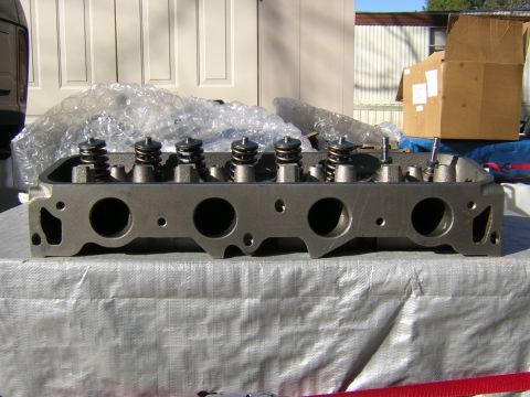 1979 Ford Bronco - A close-up view of an engine cylinder head, showing the valve train components.