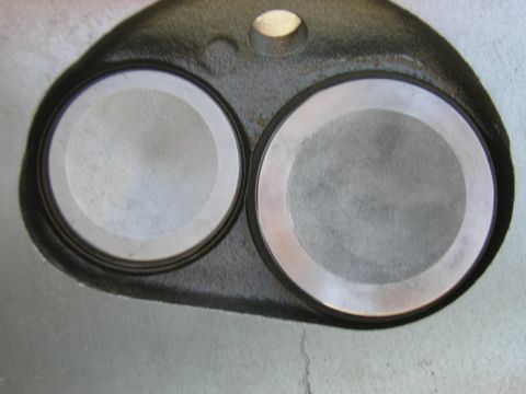 1979 Ford Bronco - Close-up view of a cylinder head, showing two circular valve seats.