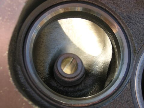 1979 Ford Bronco - Engine cylinder head part, showing internal details of a valve seat and port.