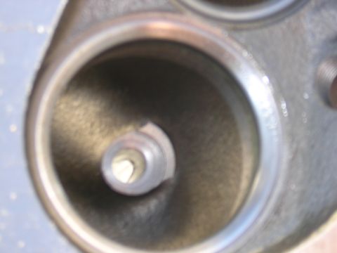 1979 Ford Bronco - Close-up view of an engine cylinder head's intake port, showing the valve seat and guide.