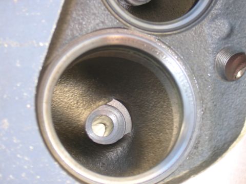 1979 Ford Bronco - Intake port of a cylinder head, showing the valve seat and port opening.