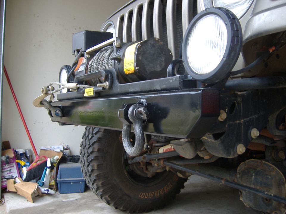 2004 Jeep Wrangler front bumper with winch, tow hooks, and auxiliary lights