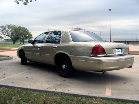 2000 Ford Crown Victoria - This 2000 Ford Crown Victoria is seen from the rear in a parking lot.