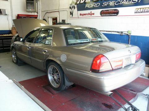 2001 Mercury Grand Marquis - A 2001 Mercury Grand Marquis is positioned on a dynamometer for testing.