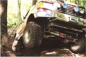 2002 Oldsmobile Aurora - This off-road vehicle is equipped for terrain, with prominent tires and auxiliary lighting.