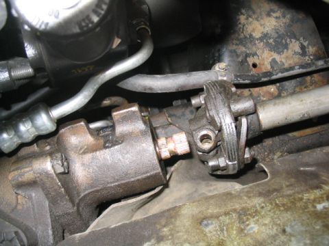 1979 Ford Bronco - This photo shows a close-up view of the steering linkage components of a vehicle.