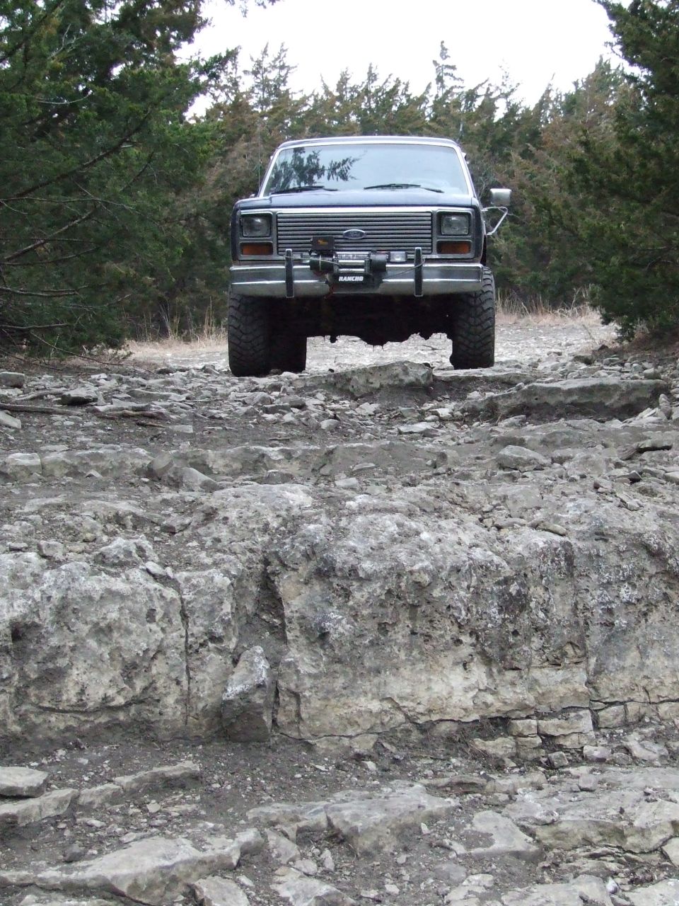 1986 Ford Bronco on rocky terrain