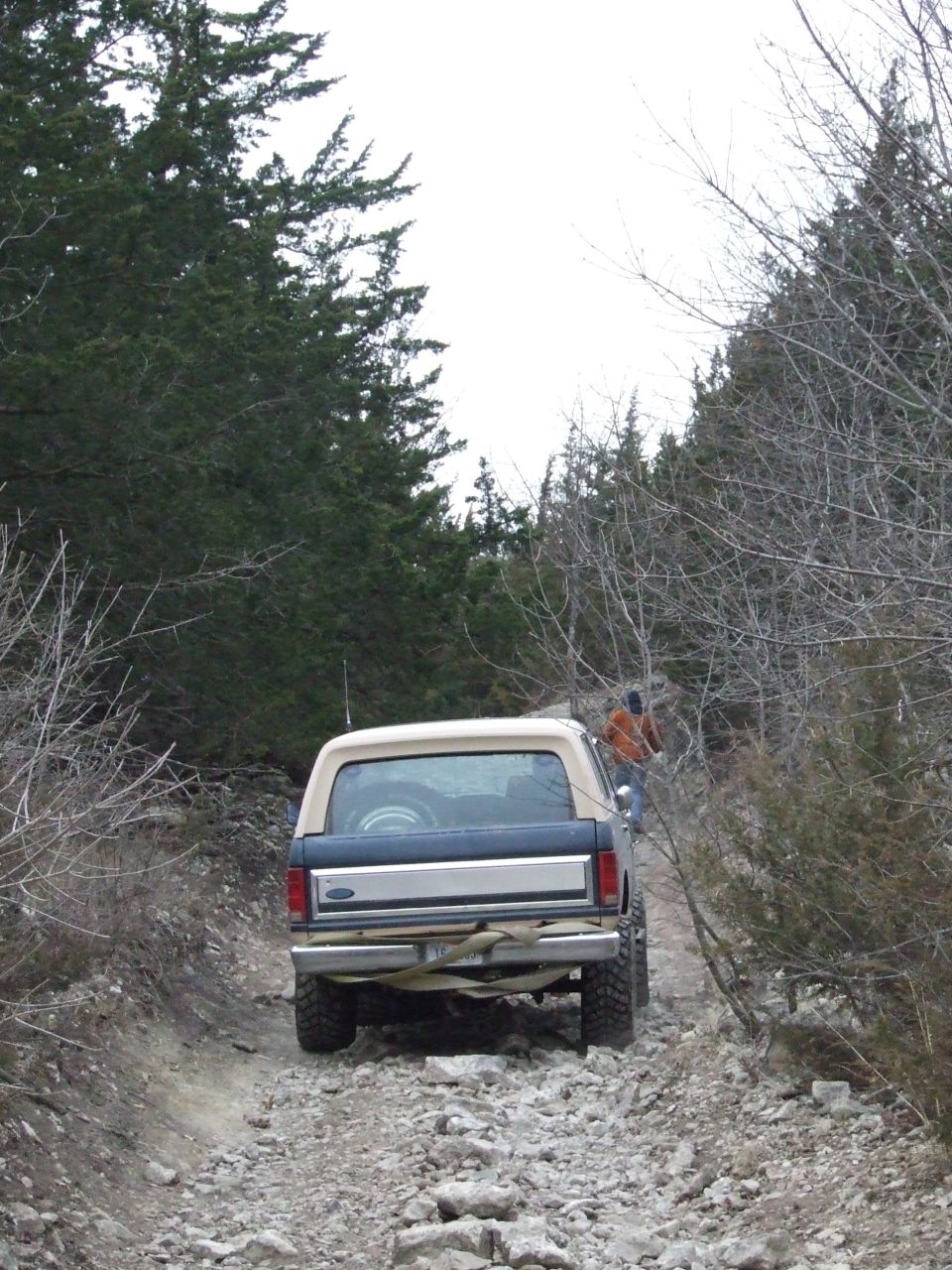 Rear view of a 1986 Ford Bronco on a rocky trail
