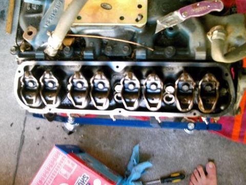 1986 Ford Bronco - Close-up view of an engine's valve train, showing the rocker arms exposed.