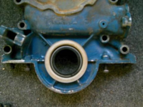 1986 Ford Bronco - Close-up of a blue engine component with a visible seal.