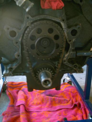 1986 Ford Bronco - Close-up of engine timing chain and gears, likely during a repair or rebuild.