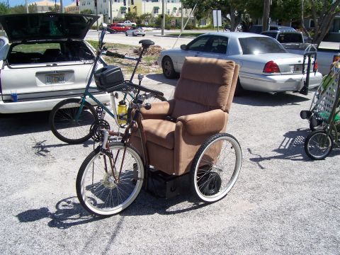 1994 Ford Probe - A custom-built mobility device combines a recliner chair with bicycle components and large rear wheels.
