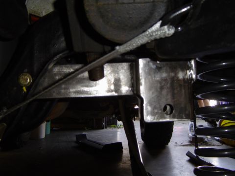 1989 Ford Bronco - Custom bracket installed on vehicle frame, likely for suspension modification.