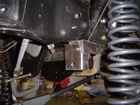 1989 Ford Bronco - Custom bracket installation on vehicle frame, with focus on suspension components.