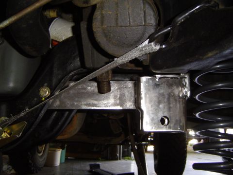 1989 Ford Bronco - Custom bracket installed on the suspension system, showing a close-up view of the work.