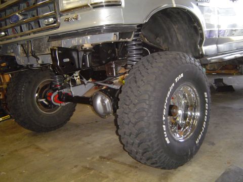1989 Ford Bronco - Front axle and suspension of a 1989 Ford Bronco undergoing modification.