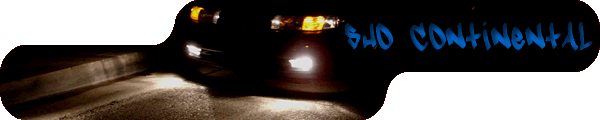 Black car with blue graffiti that says "SWD CONTINENTAL" on the rear