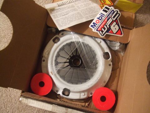 1995 Ford Probe - New clutch kit components, including pressure plate and disc, packaged in a box.