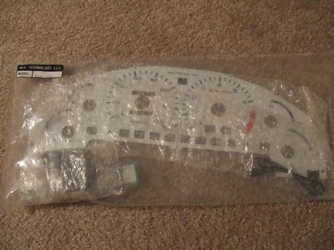 1995 Ford Probe - A new gauge cluster for a vehicle is shown in its original packaging, ready for installation.