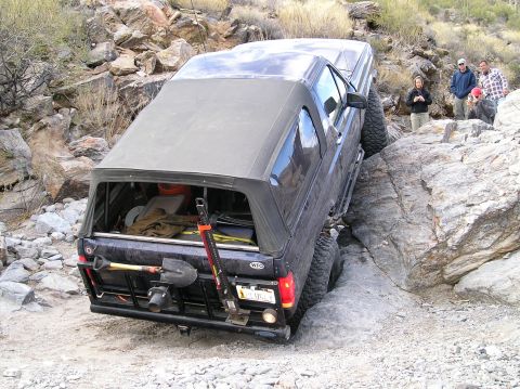 1993 Ford Bronco - This 1993 Ford Bronco is shown maneuvering through a challenging rocky off-road trail.
