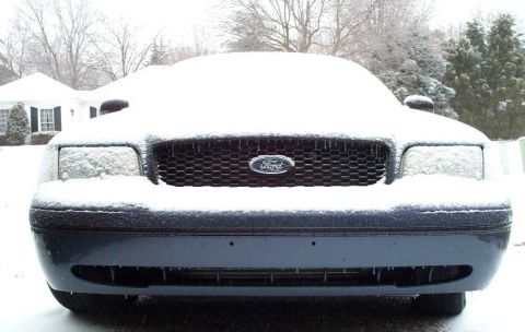 1998 Ford Crown Victoria - 1998 Ford Crown Victoria sits covered in snow during winter.