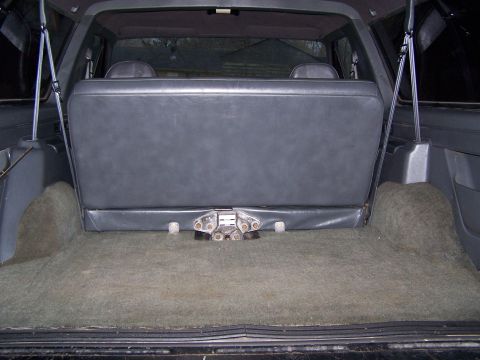 1992 Ford Bronco - The cargo area of a 1992 Ford Bronco is shown with the rear seat folded down.