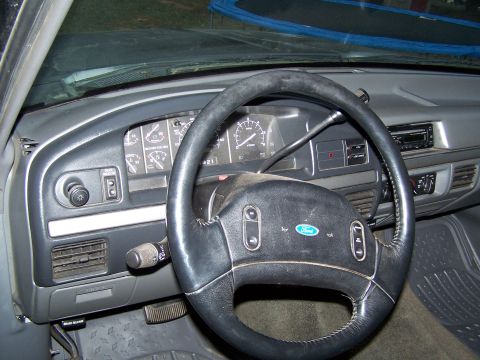 1992 Ford Bronco - The interior of a 1992 Ford Bronco, with a focus on the dashboard and steering wheel.