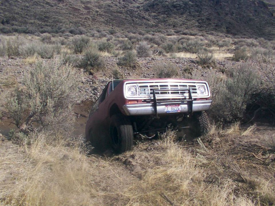 Red 1978 Dodge Ramcharger off-roading