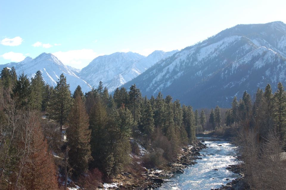 Mountain landscape with river and trees, Supermotors logo visible