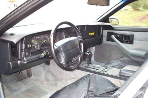 1990 Chevrolet Camaro - Interior view of a 1990 Chevrolet Camaro, the dashboard and driver's controls.