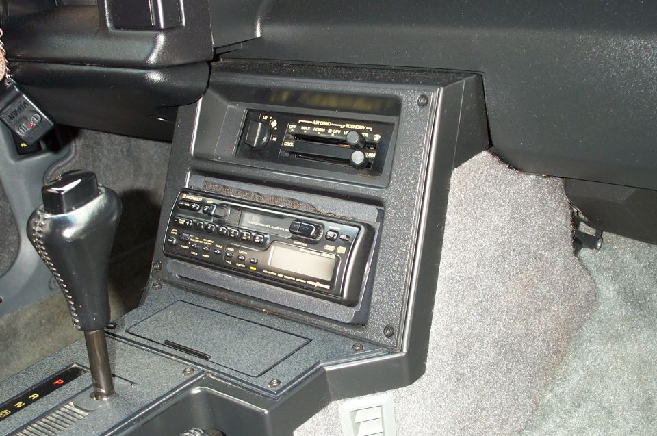 Black Camaro center console with climate controls, Pioneer cassette stereo, and automatic shifter