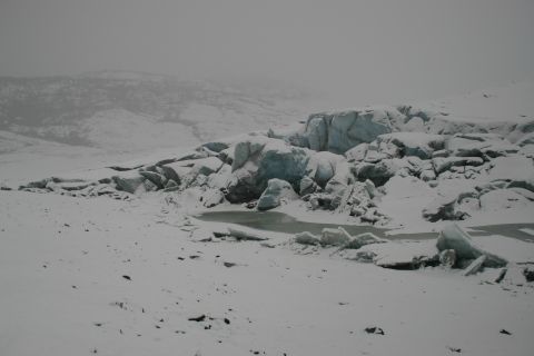 2003 Jeep TJ - A vast, snow-covered terrain with a glacier in the background under a hazy sky.