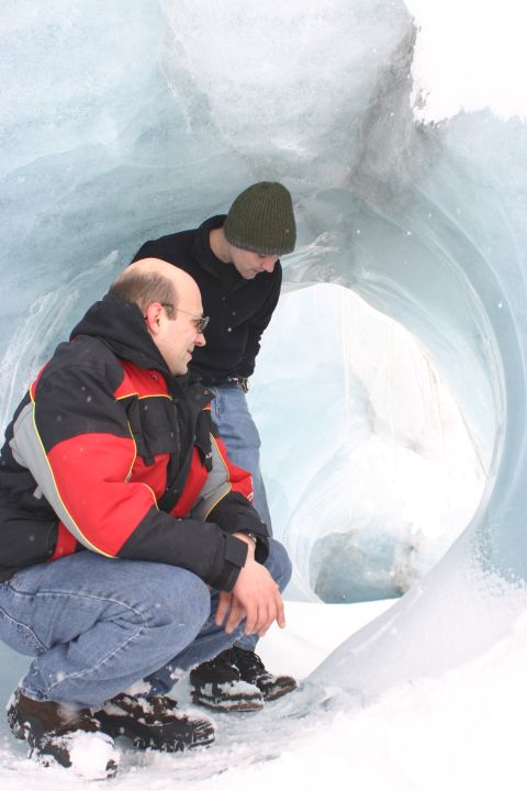2003 Jeep TJ - Exploring the interior of a glacial ice cave with snow-covered ground.