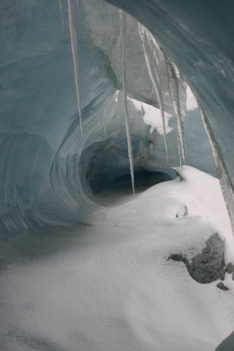 2003 Jeep TJ - A view inside an ice cave with icicles and snow.