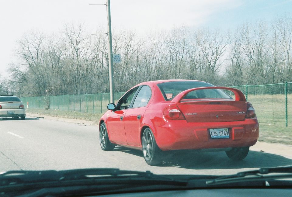 Red 2004 Dodge SRT-4 rear view with spoiler and license plate 6Z5 0749