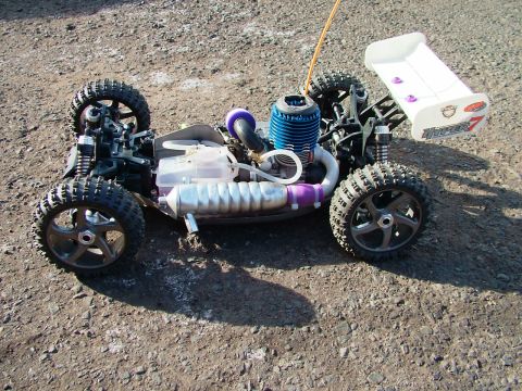 1994 Ford Bronco - This remote control buggy features a blue engine and a white rear wing with the "HYPER 7" label visible.
