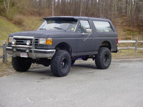 1995 Ford Mustang - This lifted Ford Bronco is equipped with off-road tires and a front push bar.