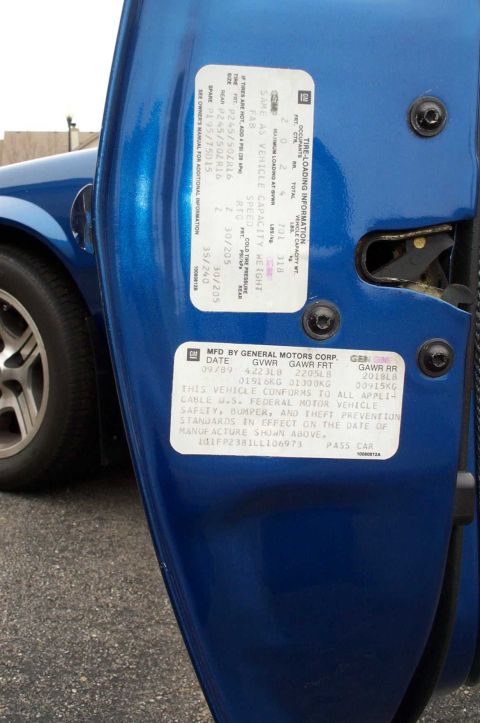 1990 Chevrolet Camaro - Door jamb stickers provide manufacturing details and tire information for the vehicle.