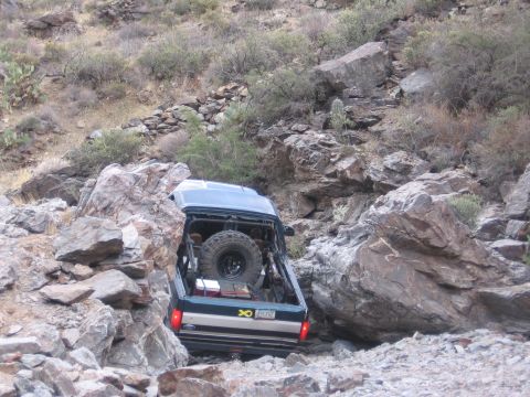 1990 Ford Bronco - This 1990 Ford Bronco tackles a challenging off-road path.