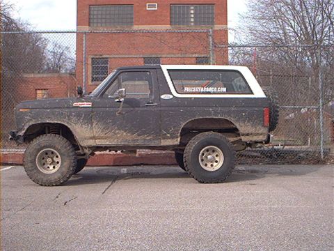 1986 Ford Bronco - This lifted 1978 Ford Bronco is covered in mud, indicating it has been used off-road.