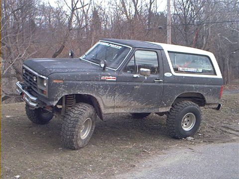 1986 Ford Bronco - This 1980 Ford Bronco is covered in mud and has been modified for off-road use.