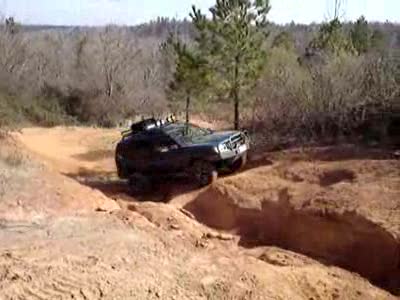 1995 Ford Bronco - Xterra in his first attempt to go up the hill climb, blew a tire off the wheel.