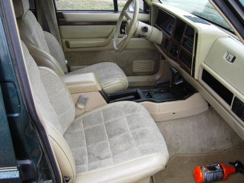 1993 Jeep Cherokee - Interior view of a 1993 Jeep Cherokee, highlighting the front seating and dashboard.